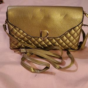 Small crossbody or can be used as wristlet
